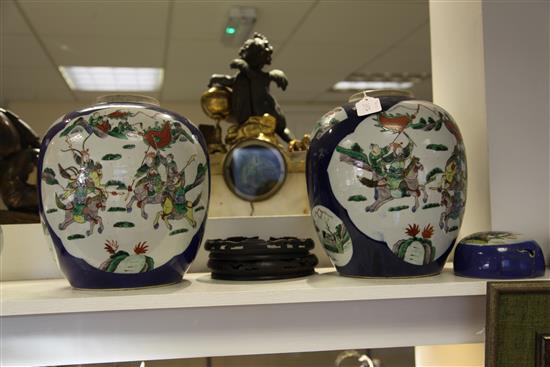 A pair of large Chinese famille verte powder blue ground jars and covers, late 19th century, 34.5cm, wood stands, one cover damaged,